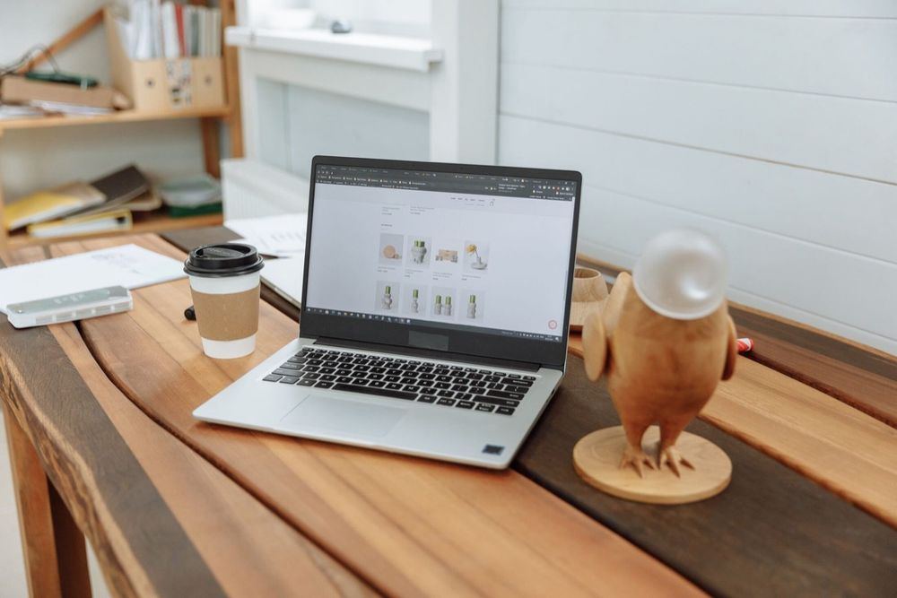 A clean, modern business website on a laptop on a wooden desk